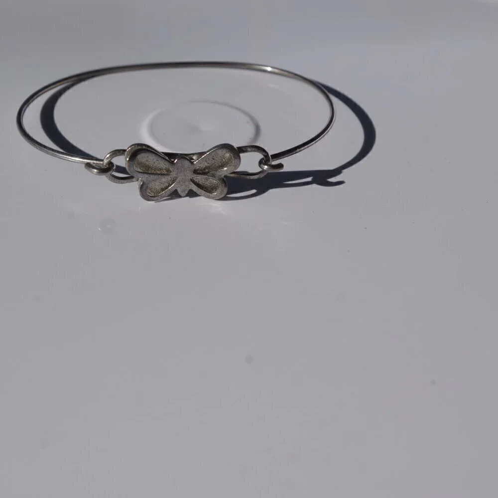 Women`s silver tone butterfly bracelet. 2 1/8 insi